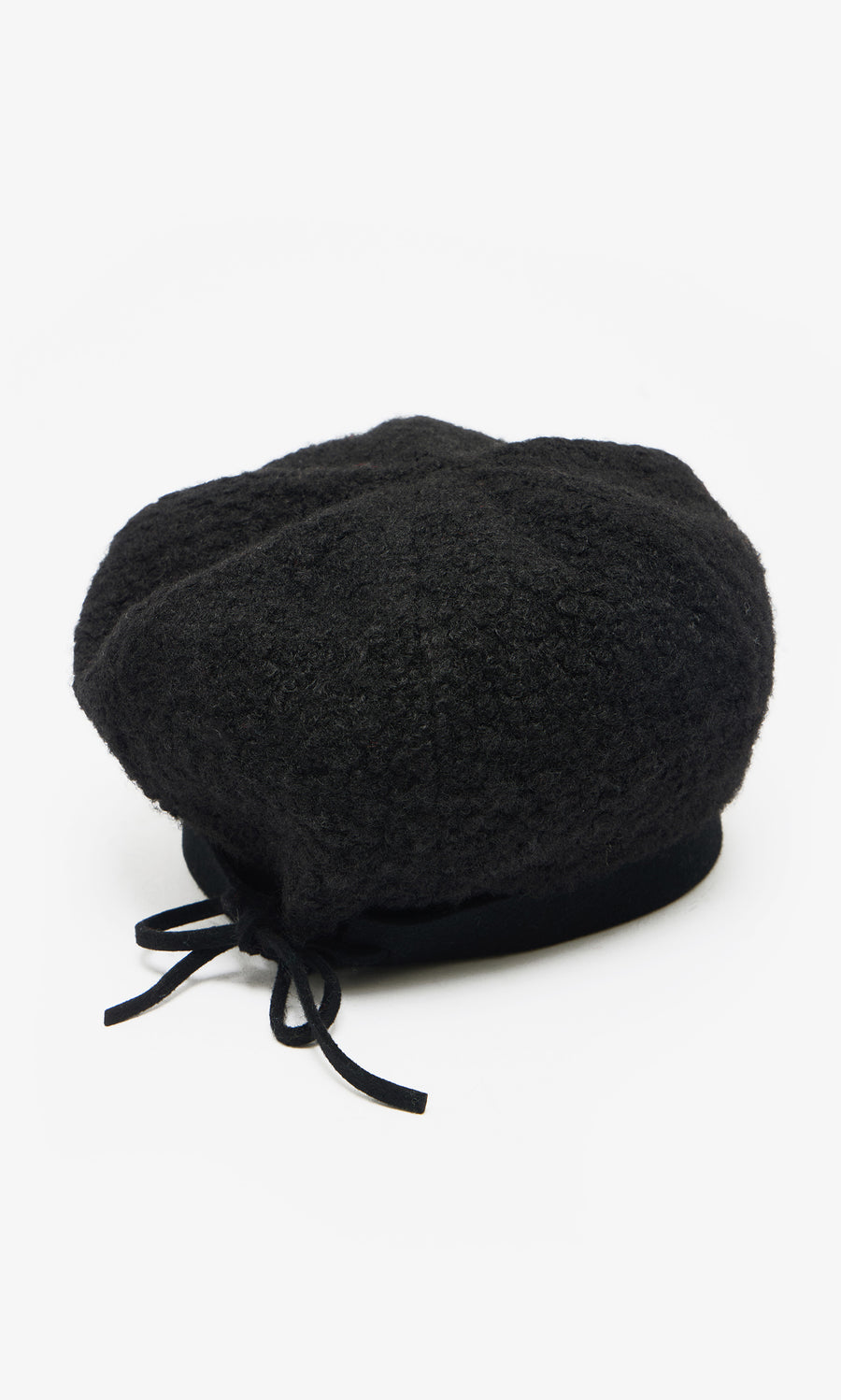 Plümo  The Perinne Beret: a handmade black Parisian boucle beret with a small back bow, shown on a white background.