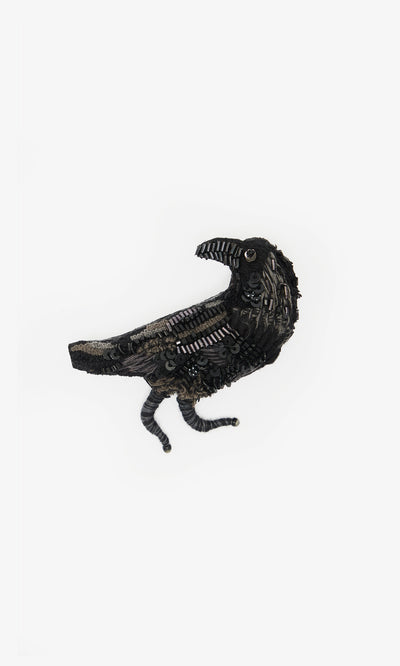 Plümo  Black Raven Brooch—handmade with sequins and beads, exquisitely embroidered on a white background.
