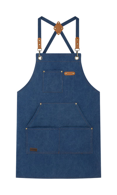 Plümo  Denim Cobbler Apron: Blue denim canvas apron with adjustable straps, pockets, leather accents, and metal grommets.