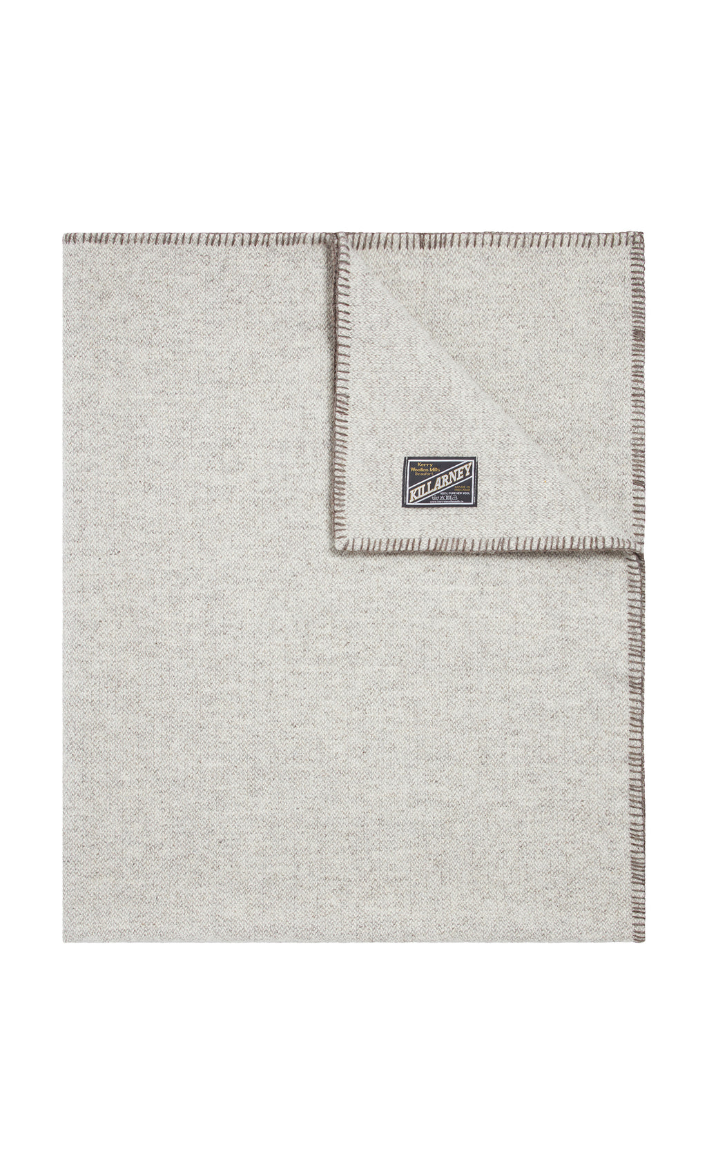 Plümo  Light gray Kilkenny Blanket - Fossil, wool with stitched edges, shown folded to display the Kilkenny label.