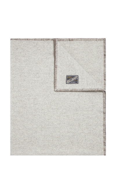 Plümo  Light gray Kilkenny Blanket - Fossil, wool with stitched edges, shown folded to display the Kilkenny label.