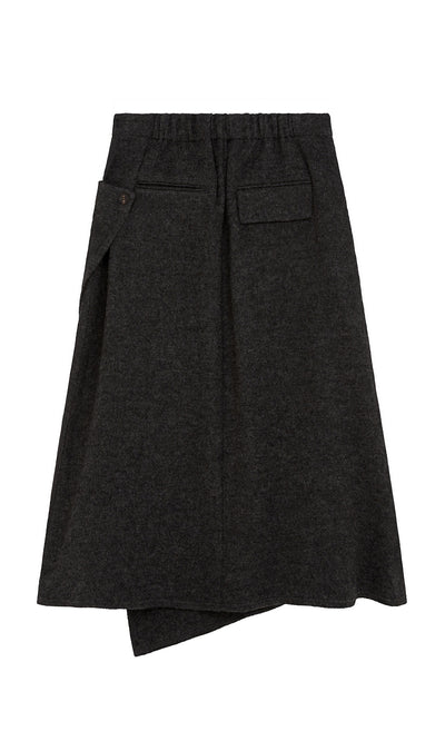 Plümo  Eardley Skirt: dark grey wool midi with front flap pocket, elastic waistband, asymmetric hem.