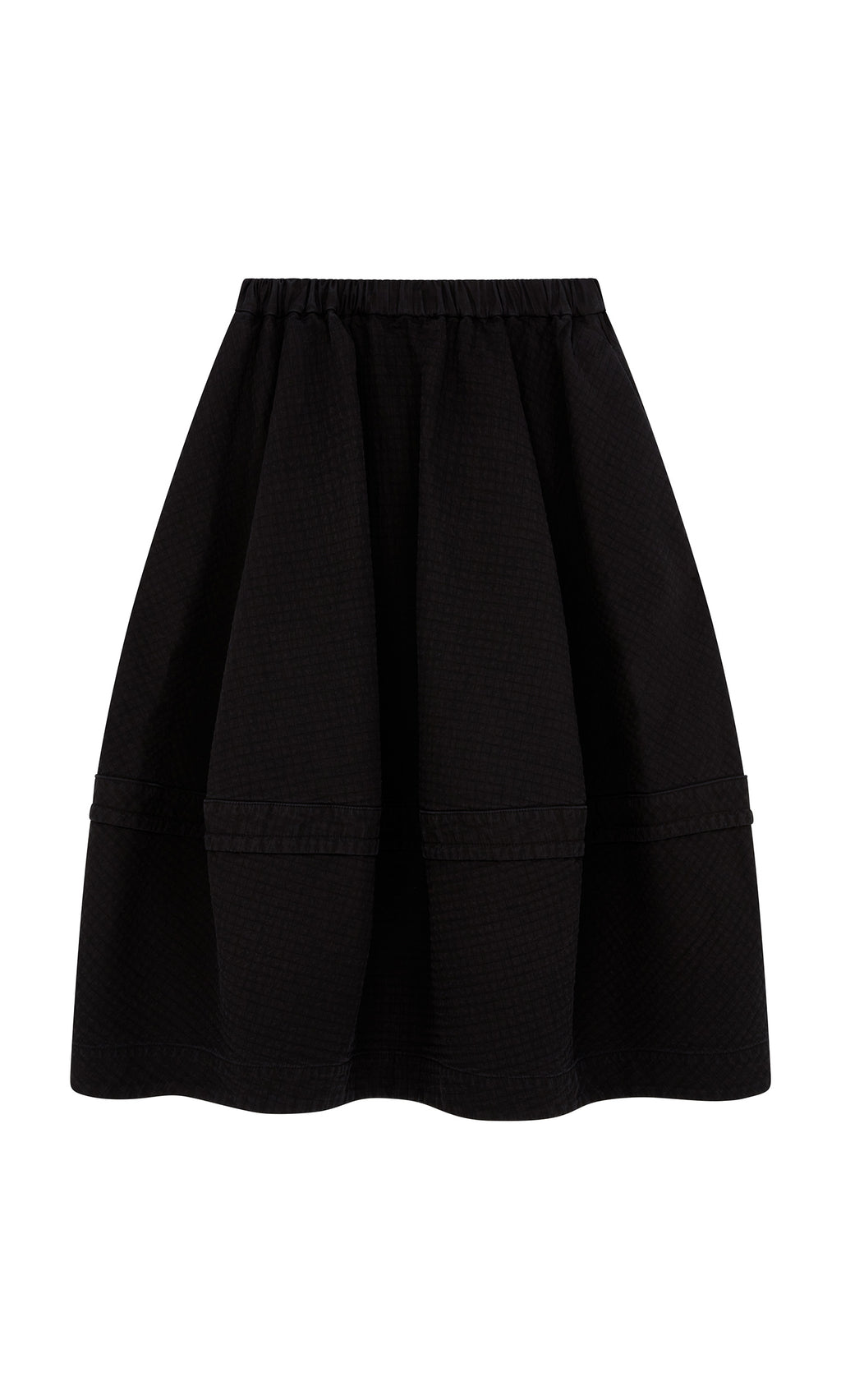 Plümo  Rho Skirt - Coal: Black quilted skirt with flared silhouette and elastic waistband for effortless, stylish comfort.