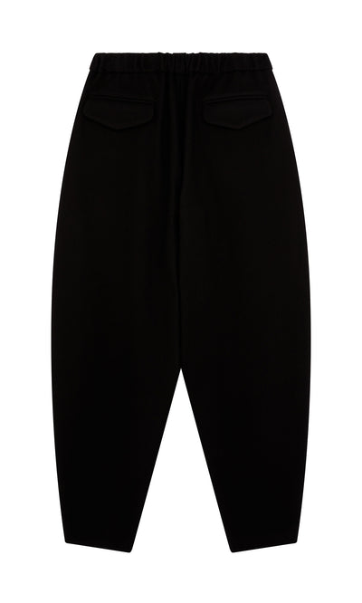Plümo  Circle Pants - Boiled Black: Wool pants with elastic waist, back flap pockets, shown on a white background.