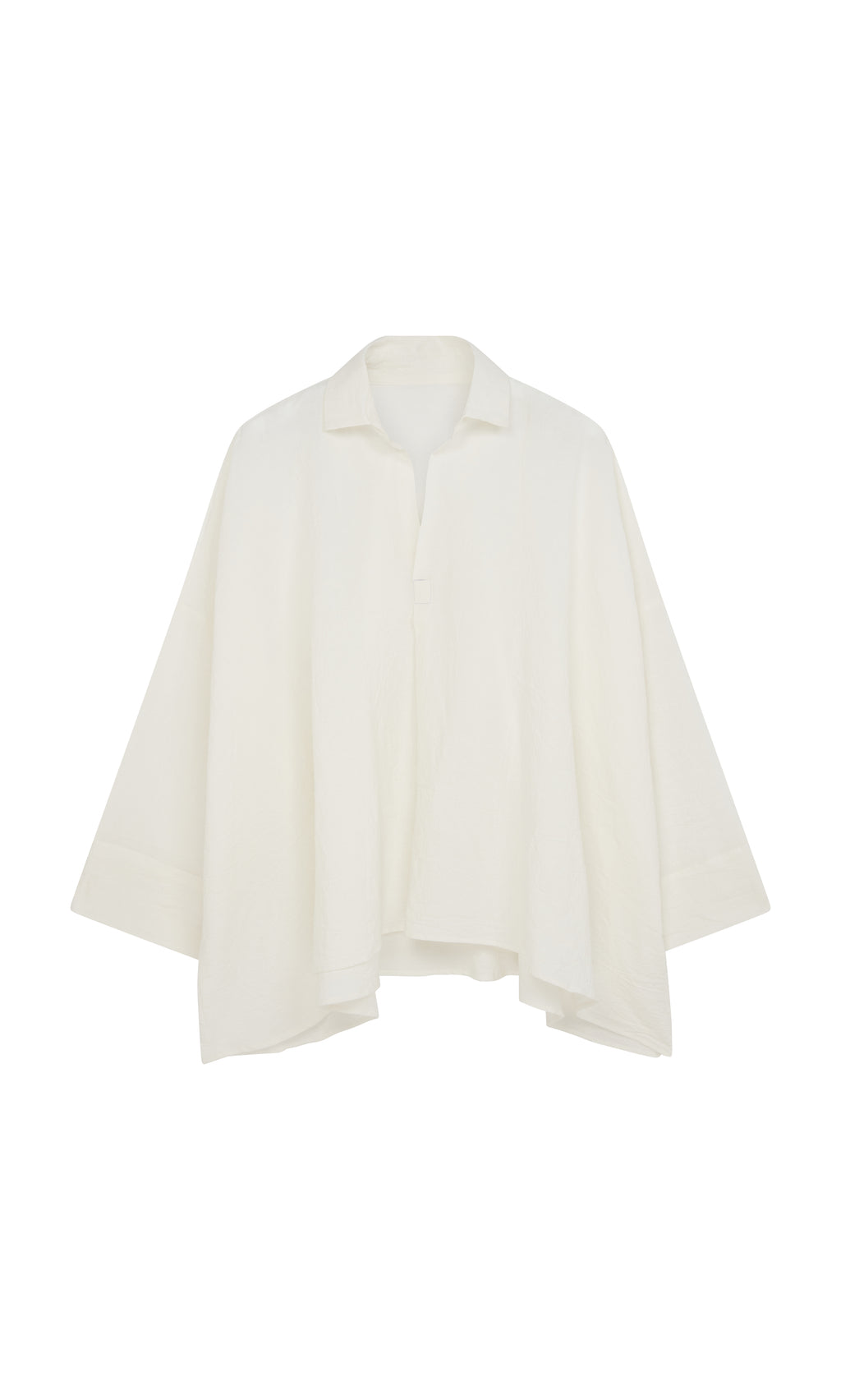 Plümo  Laundered Shirt: Loose, textured cotton shirt in white with wide sleeves and collar, inspired by an artist’s smock.