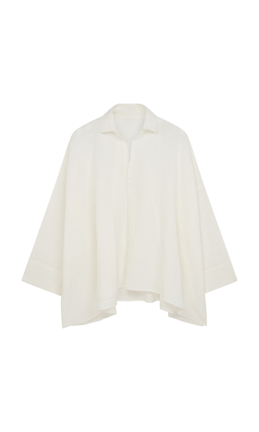 Plümo  Laundered Shirt: Loose, textured cotton shirt in white with wide sleeves and collar, inspired by an artist’s smock.