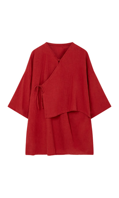 Plümo  Leila tunic: Loose poppy red linen, long sleeves, side tie, and wrap-front design.
