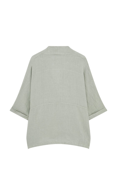 Plümo- Back view of the Carvey Tunic in light gray-green with wide cropped sleeves and an oversized relaxed fit.