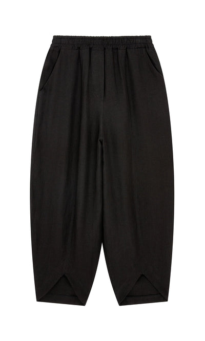 Plümo- Cazalla Pants - Black: Loose wide-leg pants with elastic waist and two side pockets, shown on a white background.