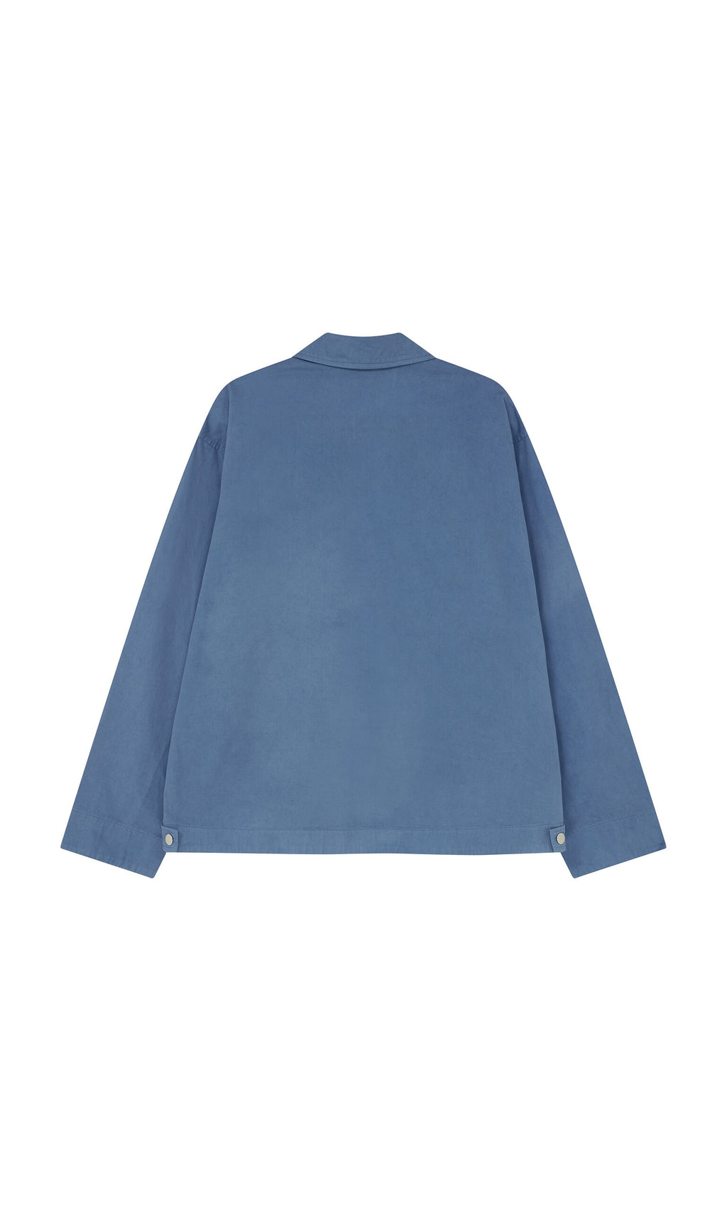 Plümo- Back view of the Flanders Jacket - French Blue, a cotton canvas workwear piece with collar and buttoned cuffs, made in London.