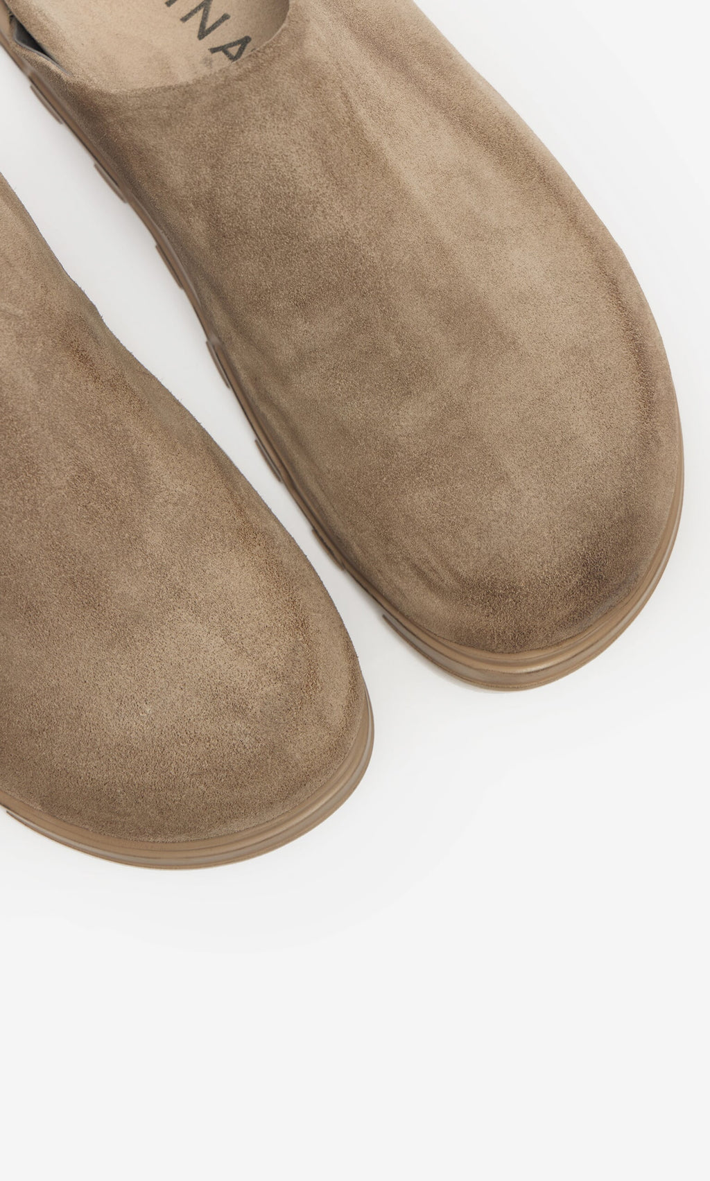 Plümo- Close-up of Como Mules—taupe suede, handmade by Lofina, with rounded toes and a comfy moulded footbed.
