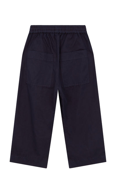 Plümo- Cromer Pants - Navy: wide-leg cotton twill with elastic waistband and back pockets, shown laid flat on white.
