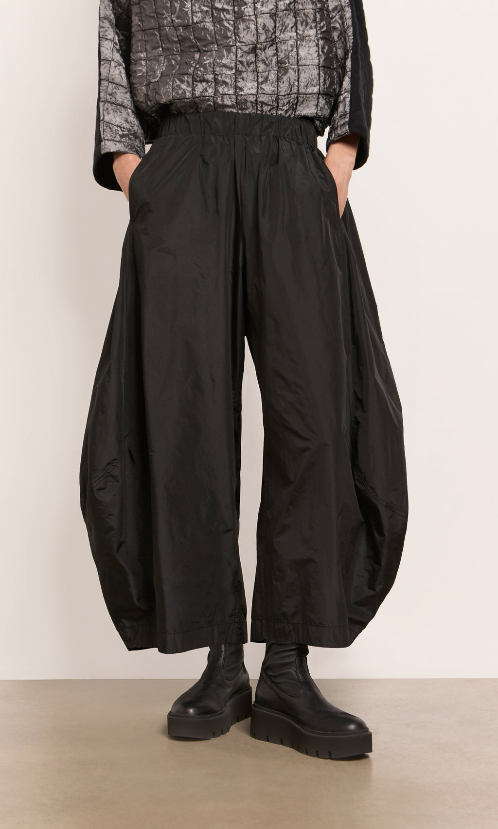 Plümo  Hooley Pants: Wide black taffeta balloon style, cropped with side pockets and elastic waist—pair with chunky boots.