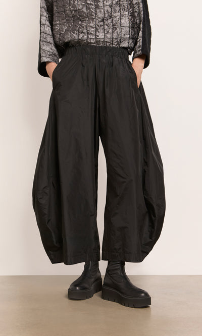 Plümo  Hooley Pants: Wide black taffeta balloon style, cropped with side pockets and elastic waist—pair with chunky boots.