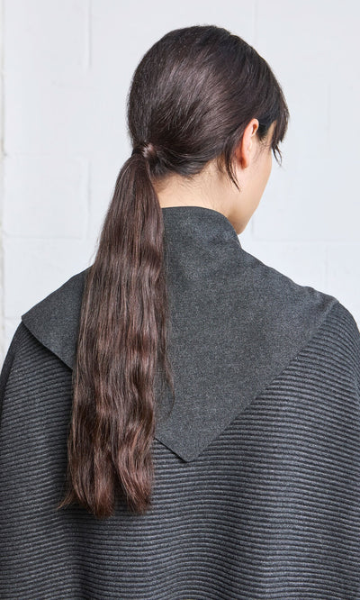 Plümo- Person with long dark hair in a low ponytail wears a gray supersoft top and Jona Necktie - Graphite, facing away.