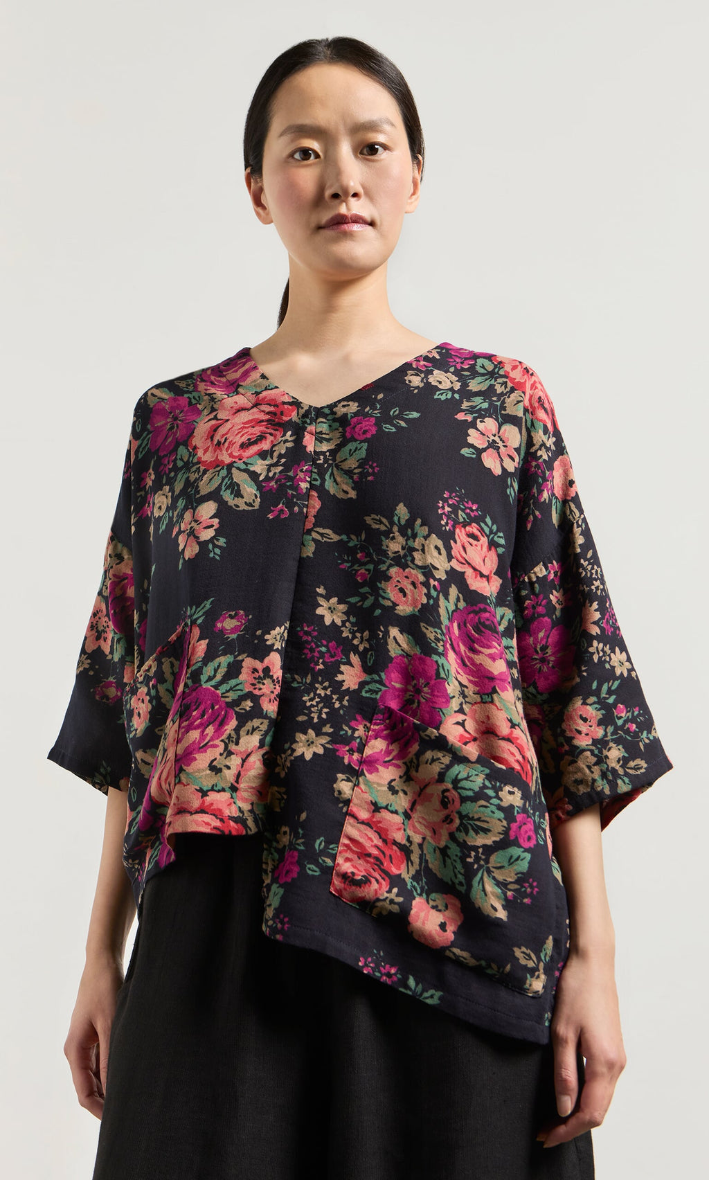 Plümo- Woman wearing the Liu Pocket Blouse in Deep Navy, standing against a plain light background.