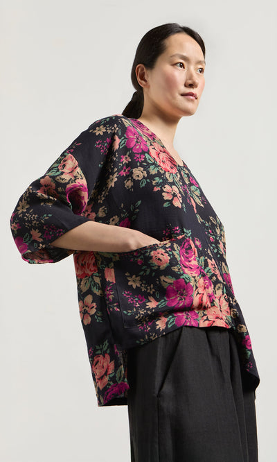 Plümo- Woman wears Liu Pocket Blouse in Deep Navy with black pants, standing against a plain light background.