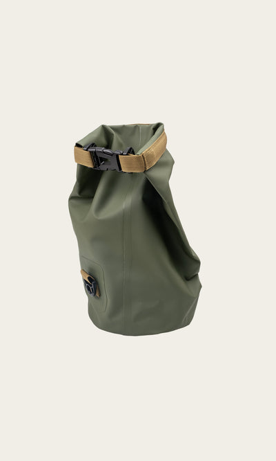 Plümo- Dry Bag - Green with tan buckle strap, roll-top design, shown upright on a plain light background.