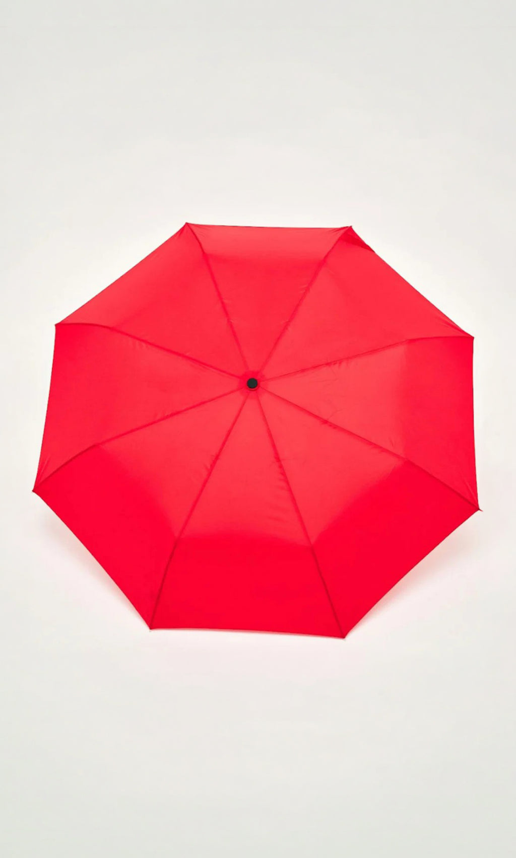 Plümo  A fully opened Duck Umbrella - Red seen from above against a plain white background.
