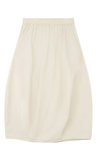 Plümo- The Edina Skirt is a beige, knee-length cotton poplin piece with an elastic waist and ballooned, egg-shaped silhouette.