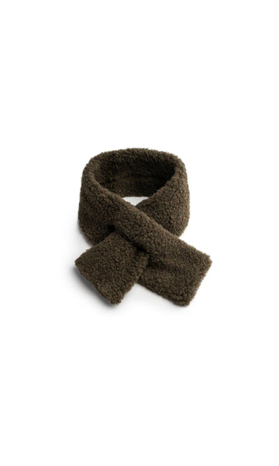 Plümo  Fern Scarf: Dark brown, textured fleece with pull-through, crossed ends on a plain white background.