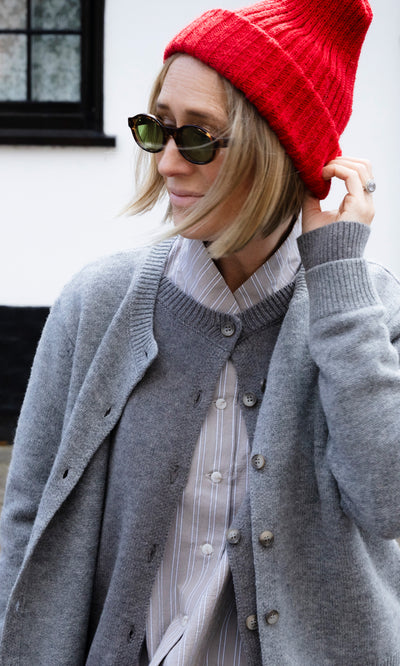 Plümo  Person wearing a Red Breton Beanie, a grey Guernsey jumper, and sunglasses.