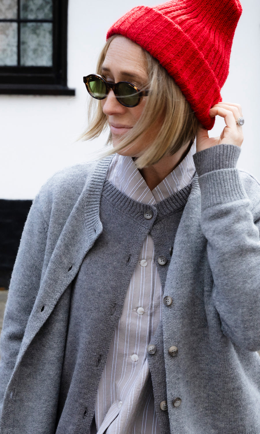 Plümo  Person wearing a Red Breton Beanie, a grey Guernsey jumper, and sunglasses.