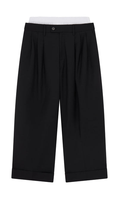Plümo- Garconne Pants: black, pleated wide-leg with belt loops, button closure, and turned-up cuffs, shown laid flat.