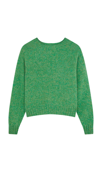 Plümo- Wicklow Crewneck in Garden Leaf—green, seam-free knit wool sweater with ribbed cuffs and hem, laid flat on white.