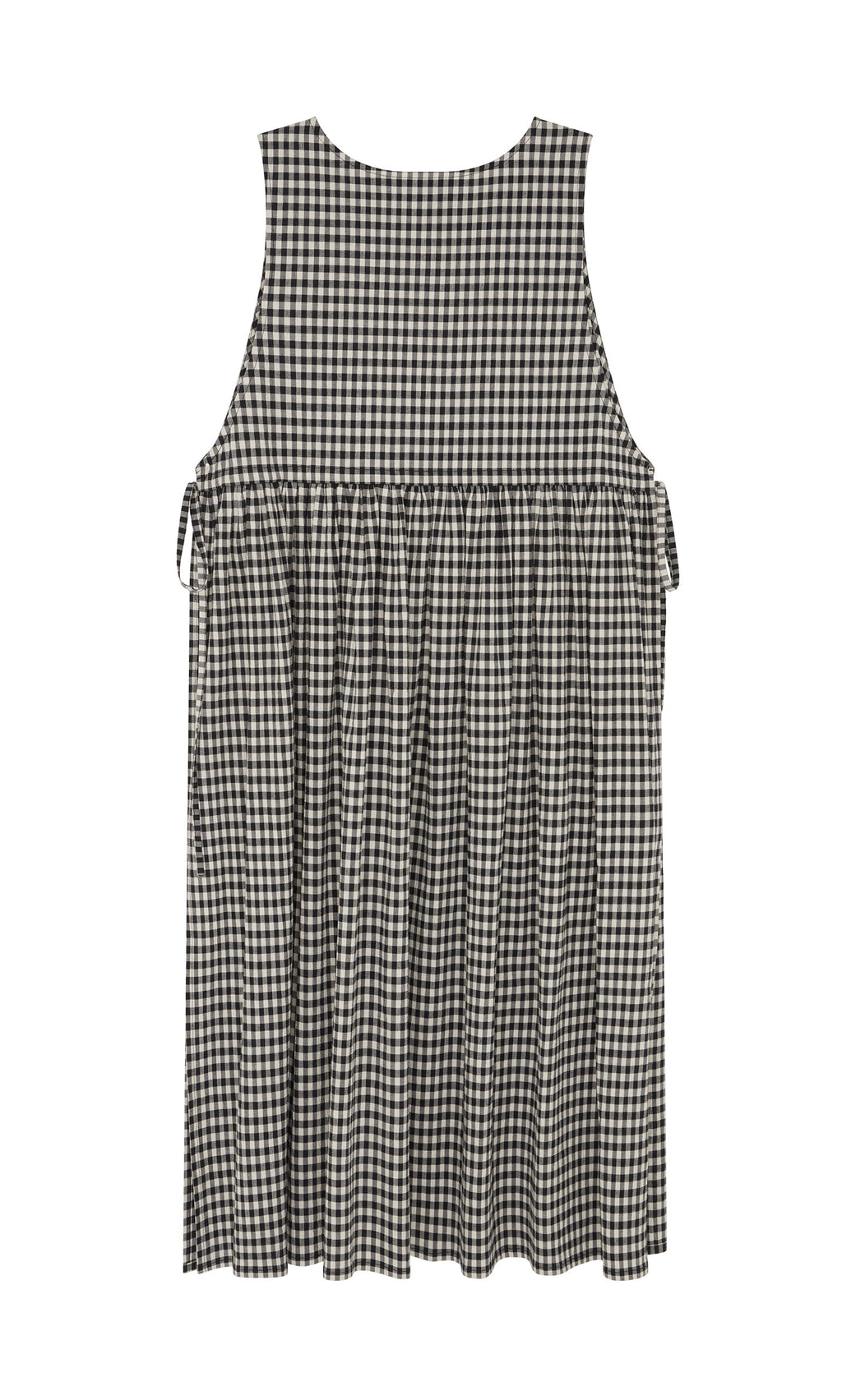 Plümo- The Apron Dress - Gingham features a black and white check, flared skirt, gathered waist, and roomy pockets.