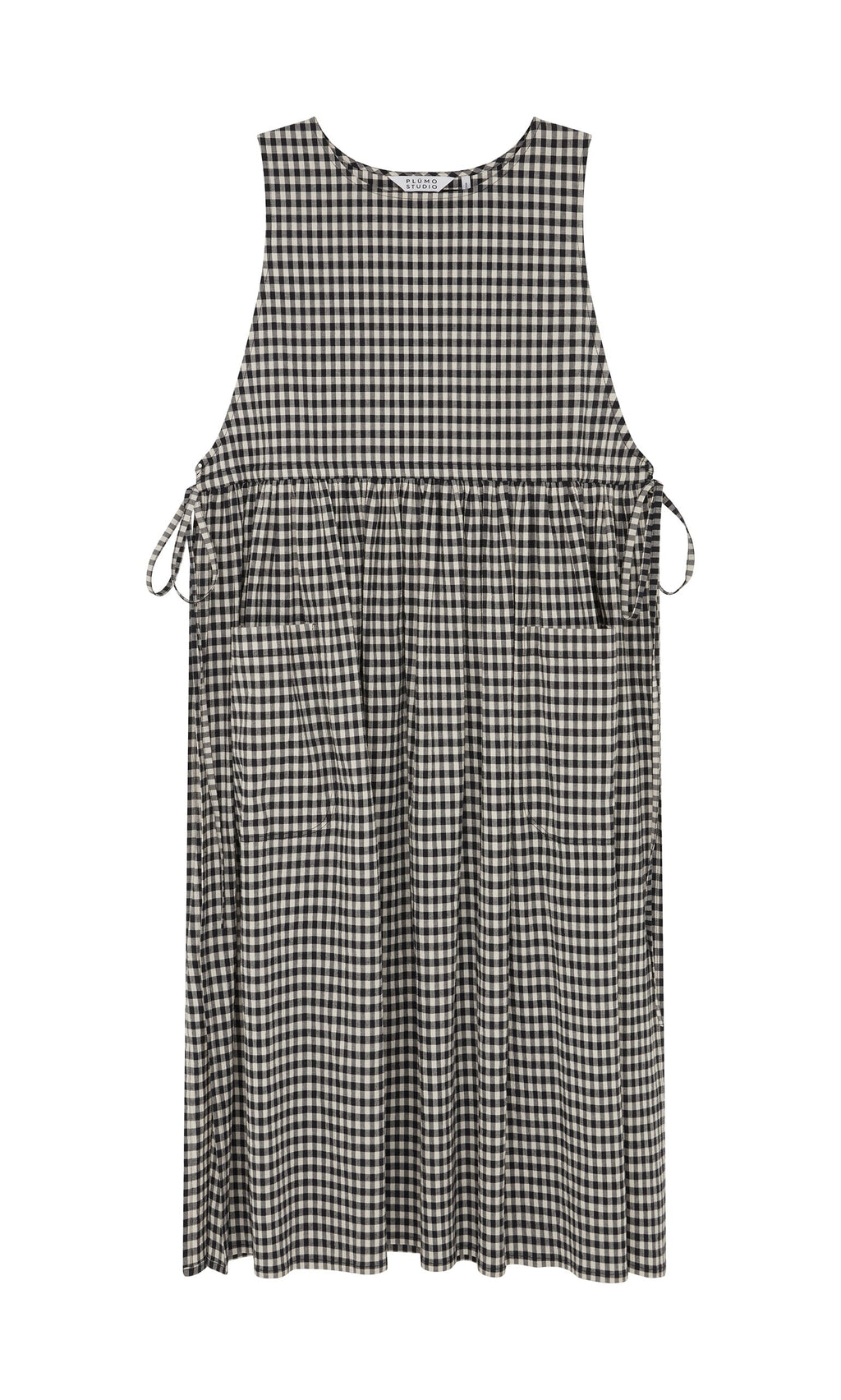 Plümo- Apron Dress - Gingham: Sleeveless black-and-white check dress with side bows, pockets, and gathered waist.