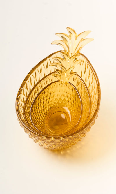 Plümo- Set of 3 amber yellow Glass Pineapple Bowls, nested together on a white surface.