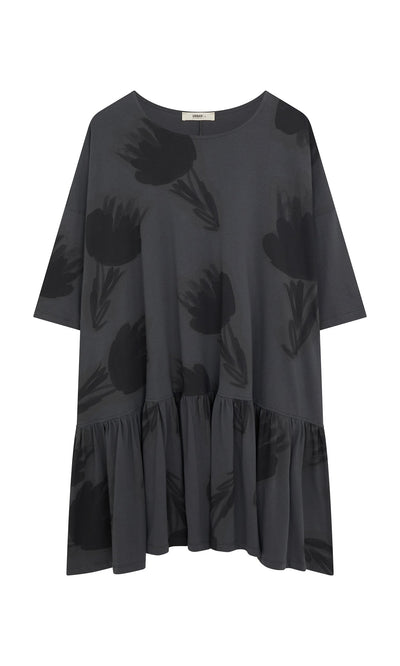Plümo- Grey Flower Blouse: Oversized dark gray cotton jersey with ruffle hem, short sleeves, and black floral prints.