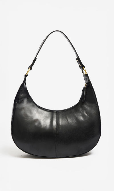 Plümo- The Hadlow Bag is a polished leather crescent with a single strap, worn as a sleek shoulder or crossbody handbag.
