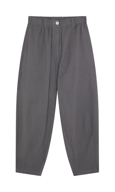 Plümo- Haru Grey Pants: wide-leg, vertical pintucks, elastic waistband, white button, shown flat on a white background.