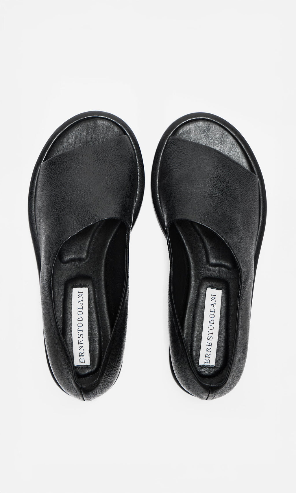 Plümo- A pair of black Hawke Sandals, artisan-made open-toe slip-ons, shown on a white background.