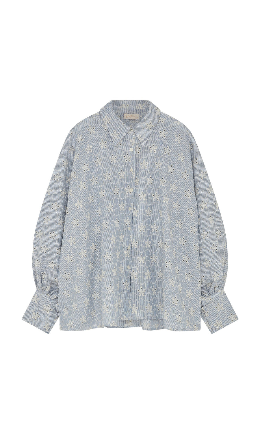 Plümo- The Hortence Blouse is a light blue broderie anglaise shirt with balloon sleeves, collar, and button closures.