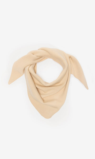 Plümo- Jona Necktie - Silt: a supersoft beige knit scarf of plant viscose, styled as a loose triangular necktie on white.