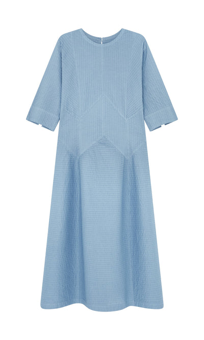 Plümo- Kai Pleated Dress: Sky blue cotton, mid-length, with pintuck panels and subtle geometric stitching.