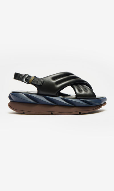 Plümo- Korra Sandals in black and navy blue leather with cushioned sole and adjustable back strap, shown side view.