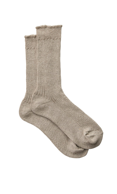 Plümo- Linen Rib Socks in light beige, crew length with ribbed cuffs, shown laid flat on a white background.