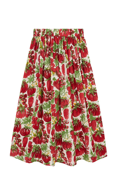 Plümo- The Marzano Skirt is knee-length with a red tomato block print and an elastic waist on a white background.