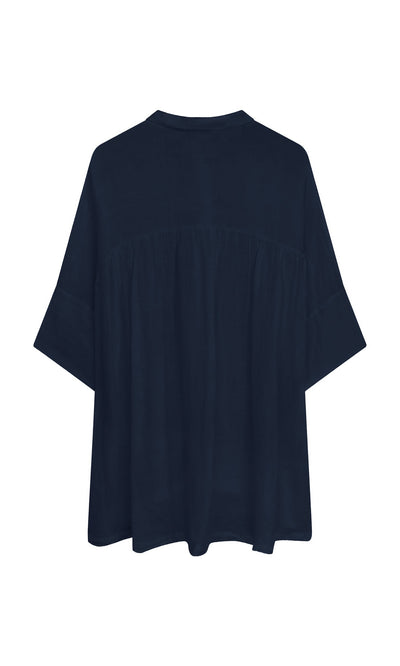 Plümo- Thistle Blouse - Deep Navy: linen blouse with a gathered yoke, loose fit, and cropped sleeves shown from the back.