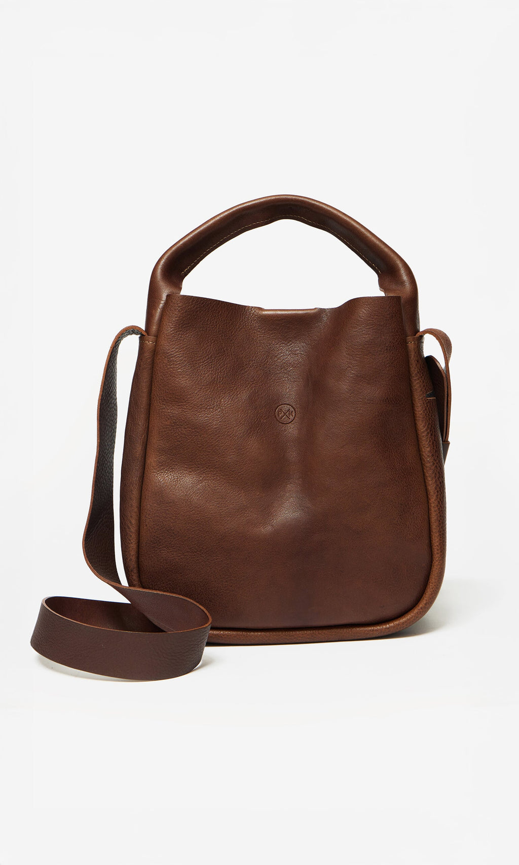 Plümo- Otto Leather Bag in brown grainy leather with top handle, embossed logo, and adjustable crossbody strap on white background.