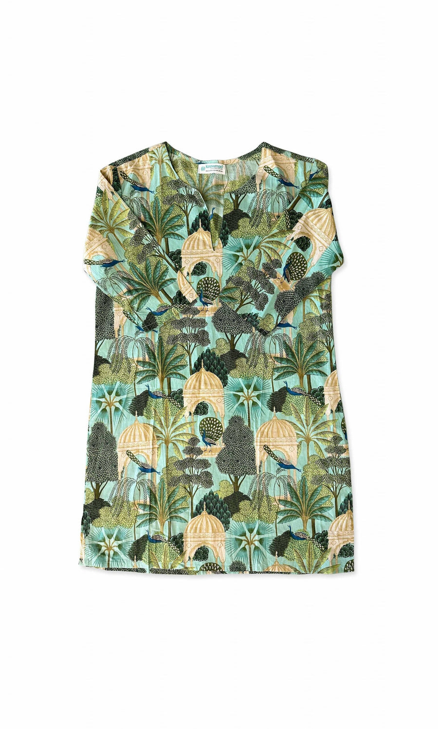 Plümo- Peacock Tunic with botanical print in green, beige, and blue, v-neckline, laid flat on white background.