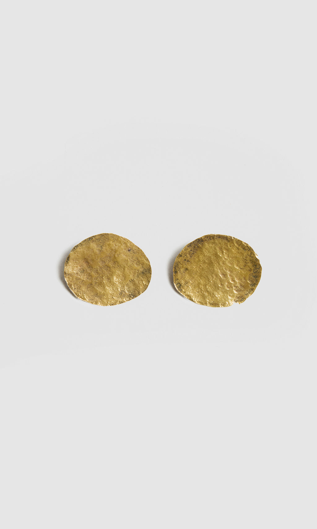 Plümo  Two round, textured Cohen Earrings in recycled brass capture the unique handmade jewellery style of Cornwall.