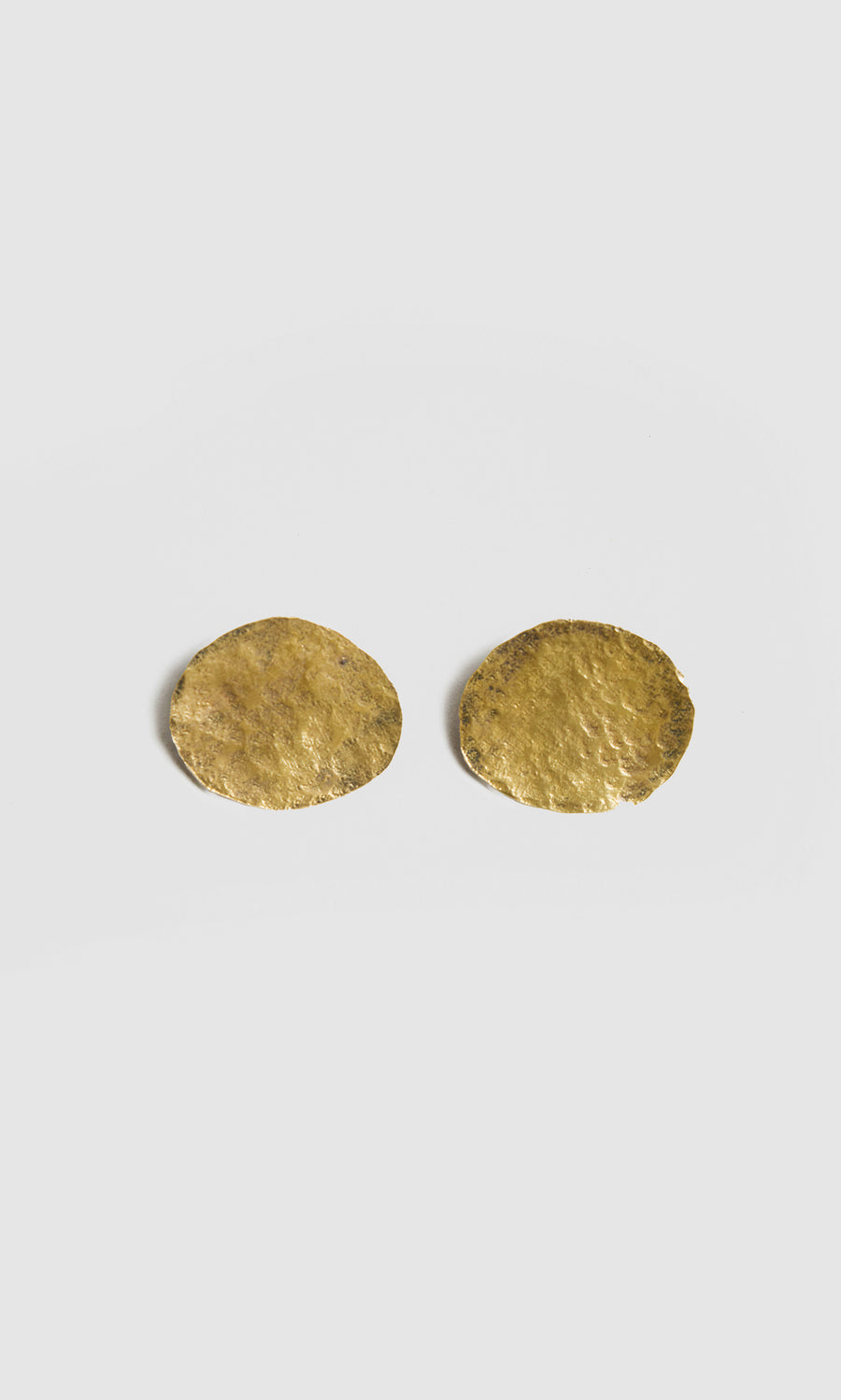 Plümo  Two round, textured Cohen Earrings in recycled brass capture the unique handmade jewellery style of Cornwall.