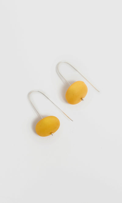 Plümo  Bola Earrings - Honey Dew: Drop earrings with yellow beads on eco-silver hooks, shown on a white background.