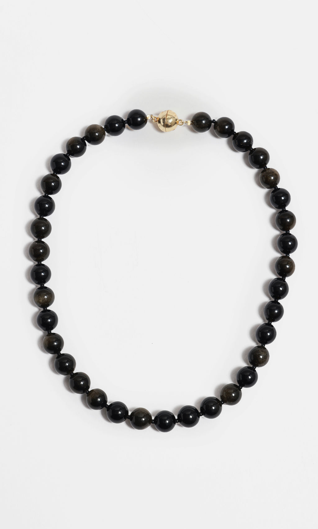 Plümo  Olena Necklace—golden obsidian beads with 18kt gold-plated clasp, styled in a circle on white background.