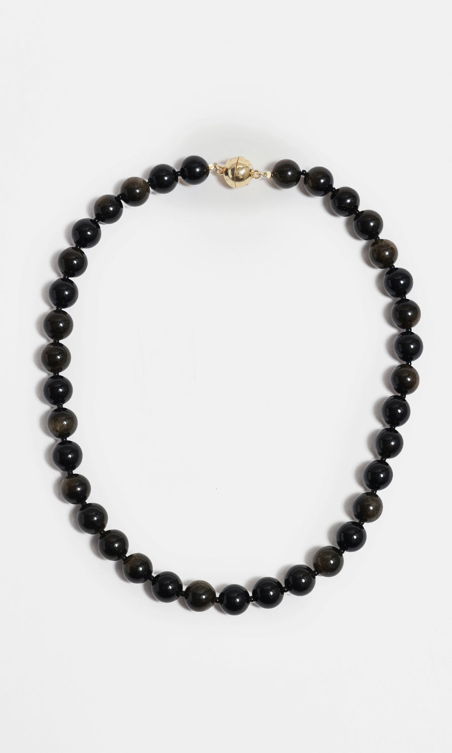 Plümo  Olena Necklace—golden obsidian beads with 18kt gold-plated clasp, styled in a circle on white background.